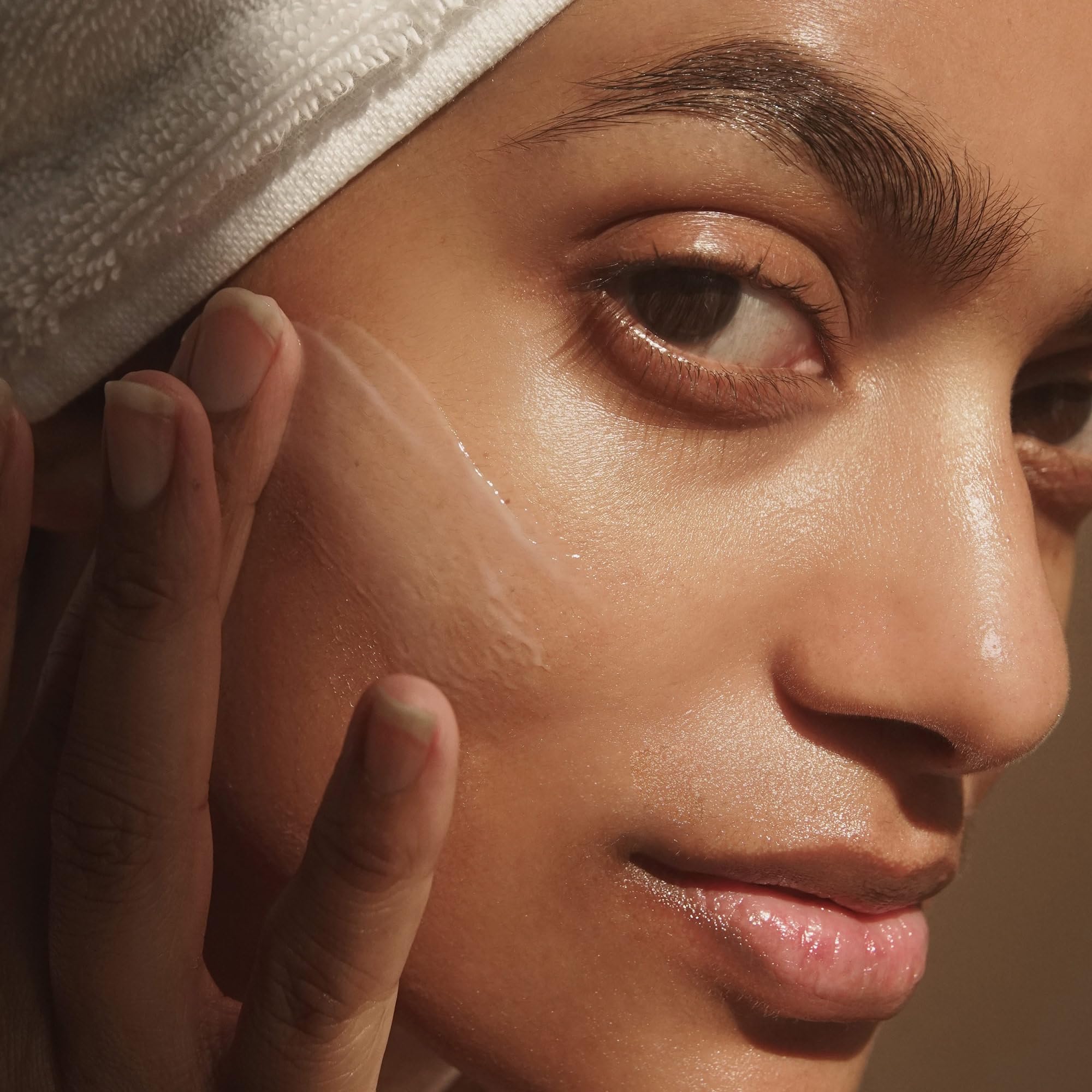 Gentle facial massage showing smooth absorption into skin.