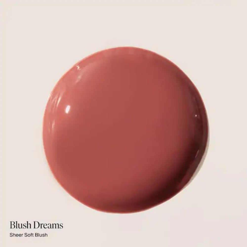 Summer Fridays Dream Lip Oil bottle close-up highlighting vegan packaging.