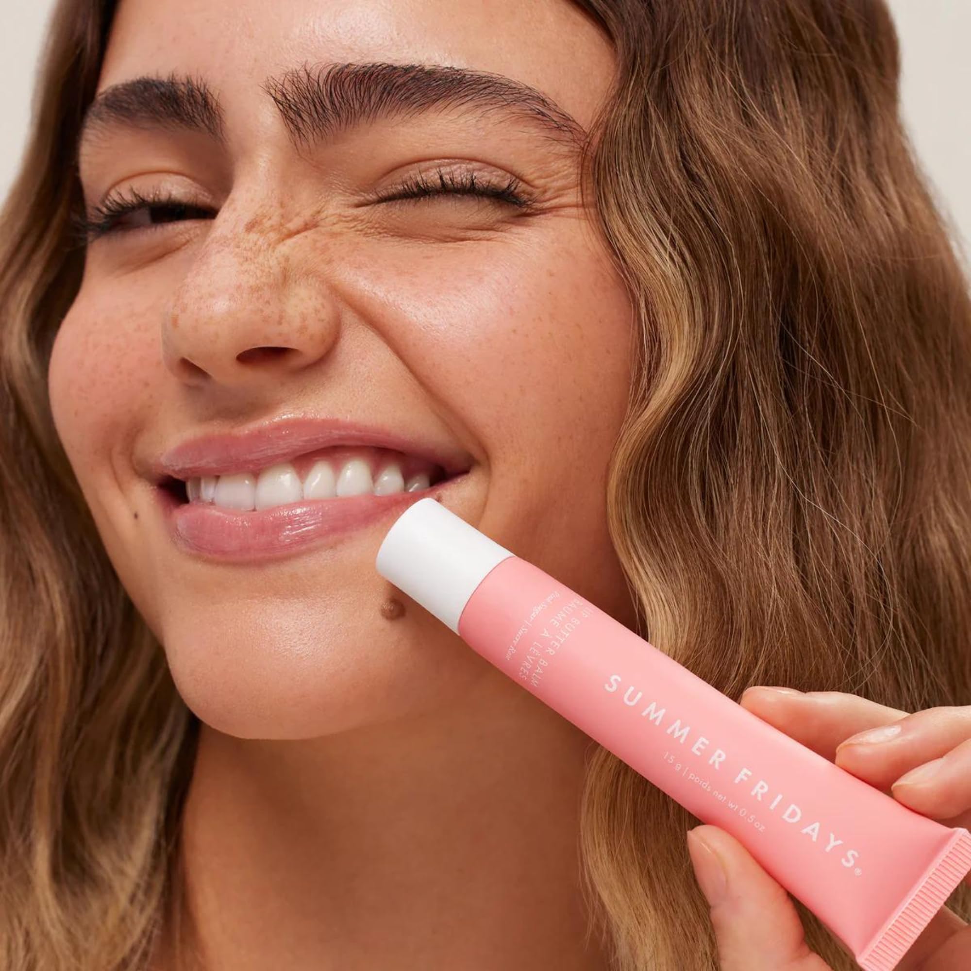 Soft pink tint swirls on lips for natural everyday glow.