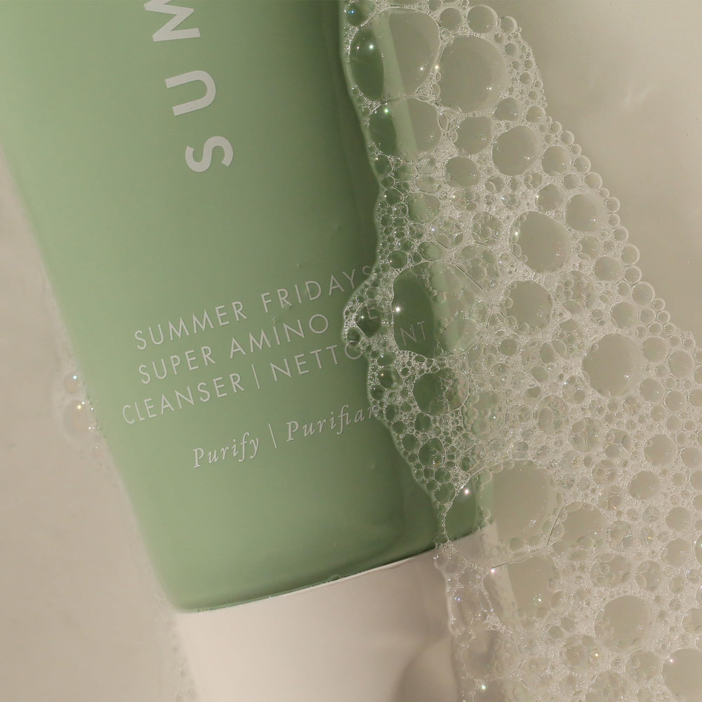 Summer Fridays Super Amino Gel Cleanser hand applying gentle circular massage on the face.