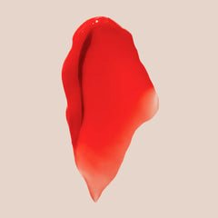Closeup of Summer Fridays Tinted Lip Butter Poppy showing coral shade