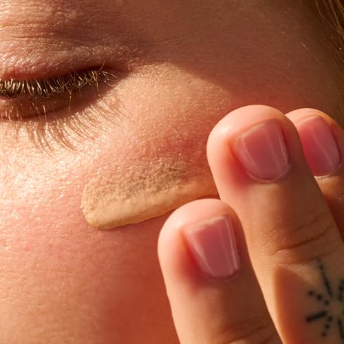 Hands applying Sun Bum Glow demonstrates easy daily protection.