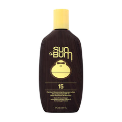 Sun Bum Original SPF 15 lotion bottle on a sunny beach, protecting skin daily