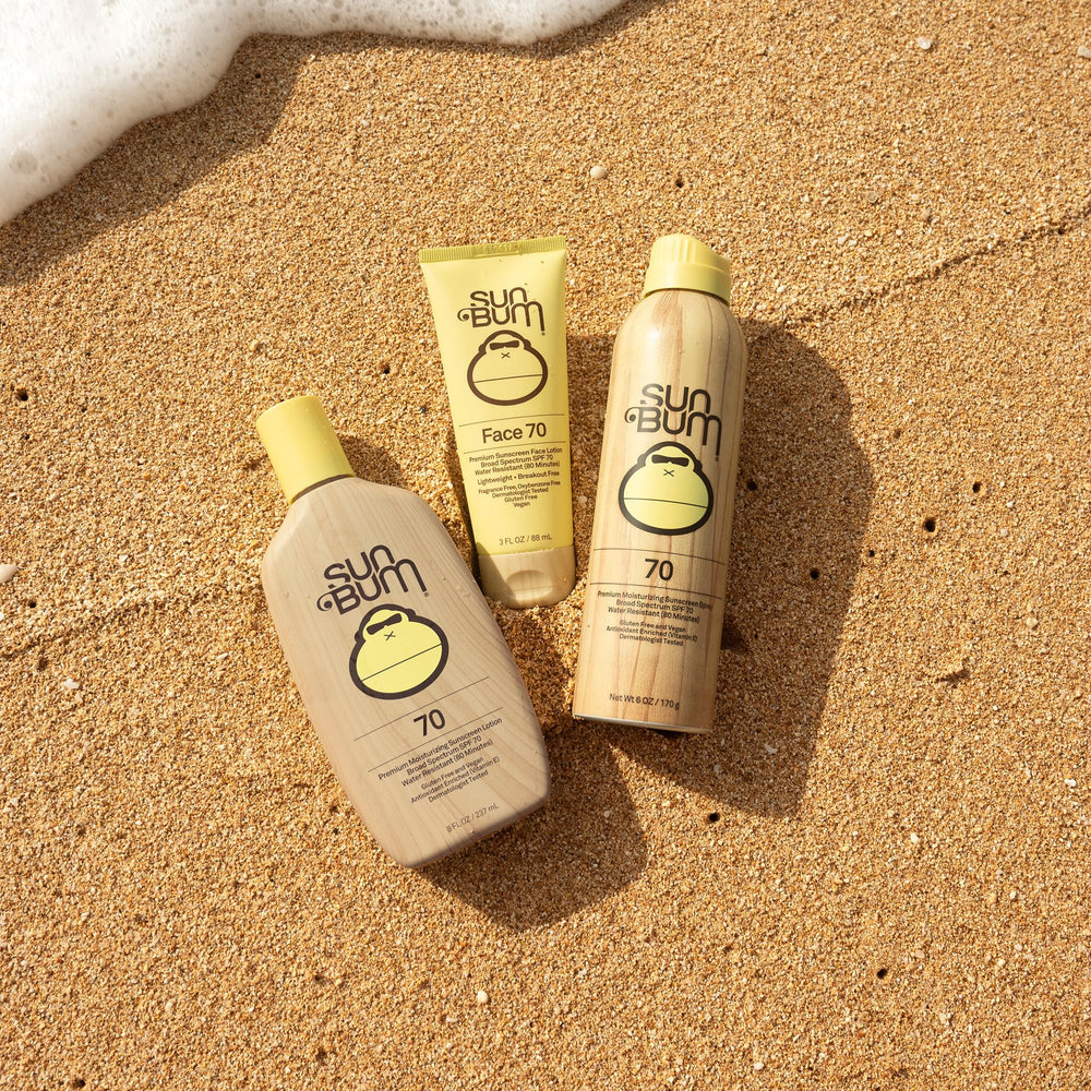 Sun Bum Original SPF 70 spray, envase de 6 oz, ideal para viajes a la playa.