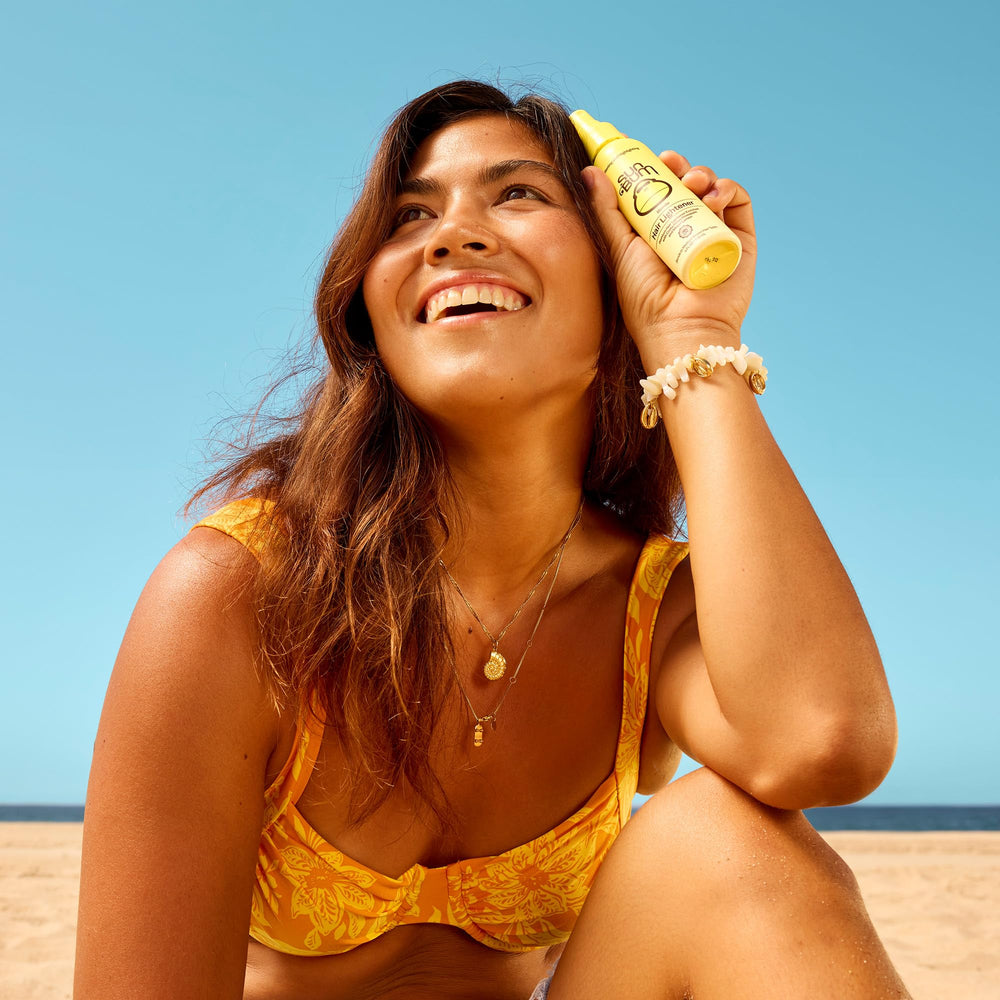 HairCare with Sun Bum UV protection imagery outdoors in sunlight.