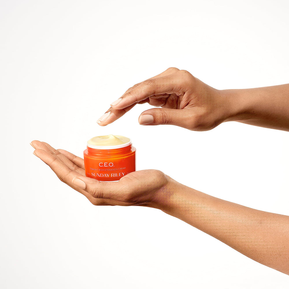 Sunday Riley C.E.O. Cream being spread on skin for a non-greasy luminous finish.