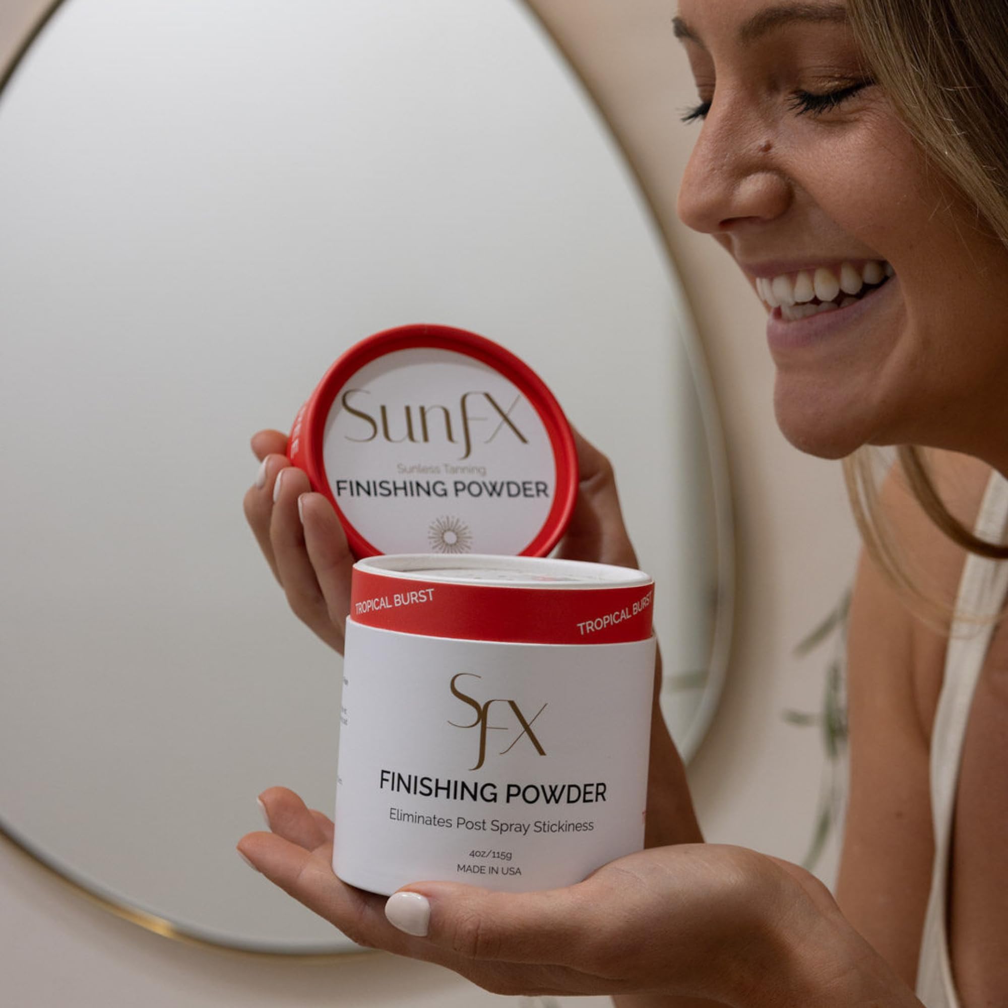 SunFX Post Spray Tan Finishing Powder tropical-burst applied on chest decolletage for even set.