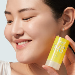 Supergoop Glow Stick applied on body for quick sun protection