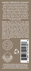 Surface Awaken Therapeutic Shampoo label highlights natural ingredients and menthol benefits.