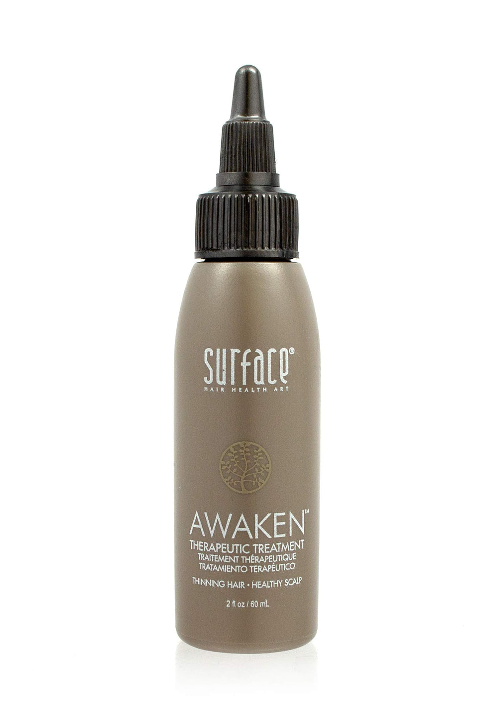 Surface Awaken Therapeutic Treatment bottle on shelf promotes scalp nourishment.