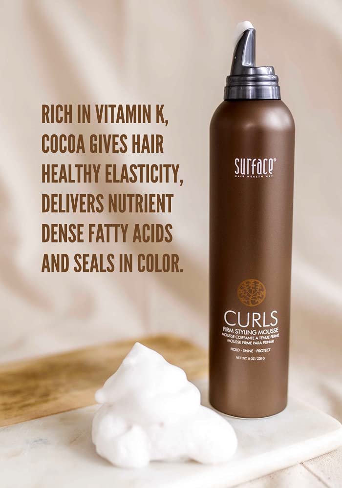 SURFACE Curls Firm Mousse being applied to damp hair for curl definition.