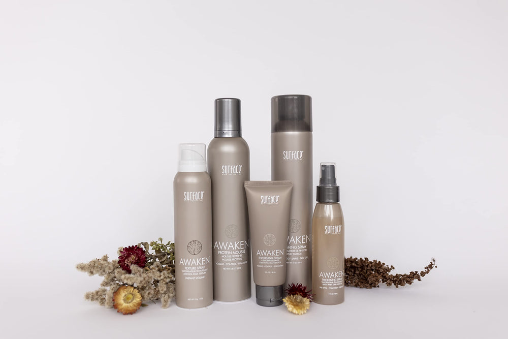 Packaging variations of SURFACE Hair Awaken Thickening Cream on display