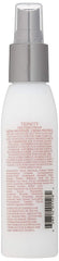 SURFACE Trinity Leave-In dispense-into-hand shows easy application on damp hair