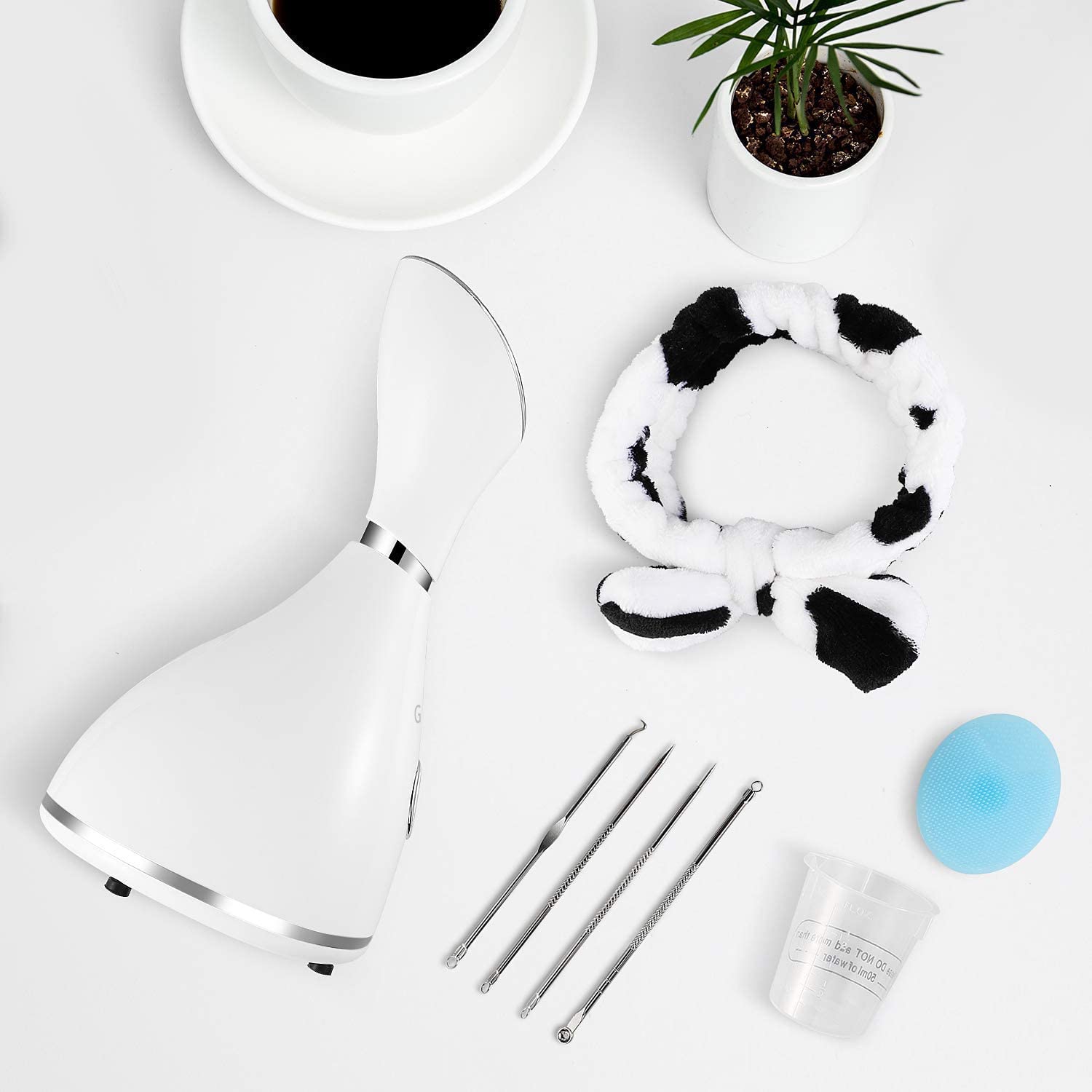 Surwit GETANYE steamer with face brush for cleansing prep.