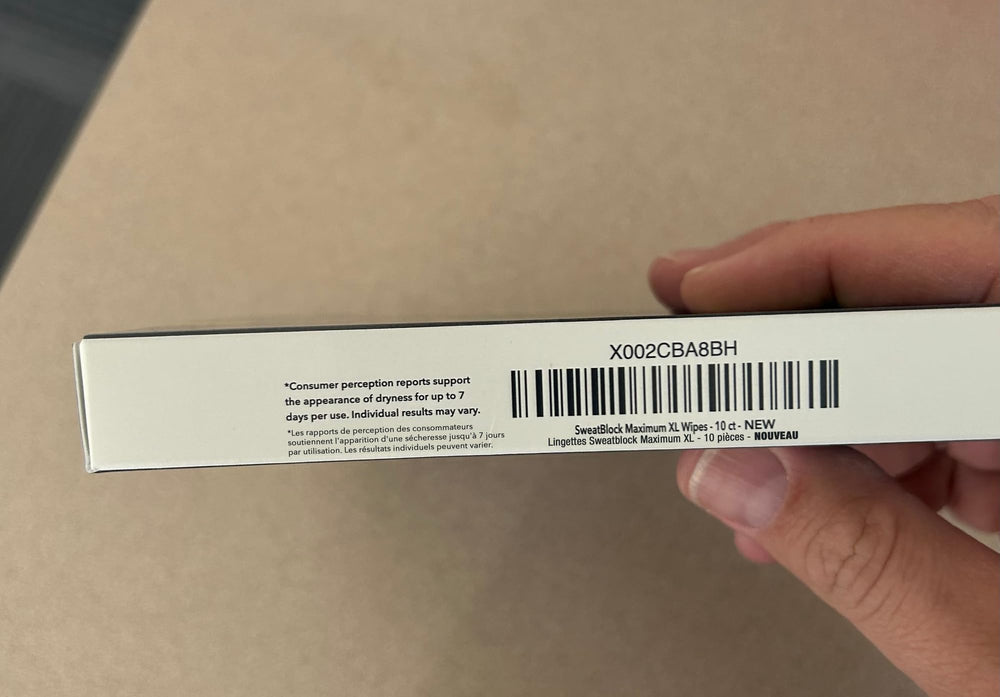 Open SweatBlock packaging showing convenient wipes.