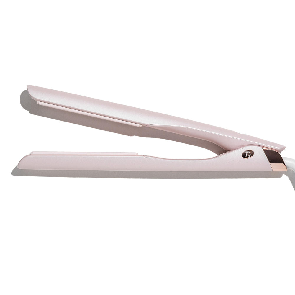 T3 flat iron curling and waving capabilities demonstrated on a model.