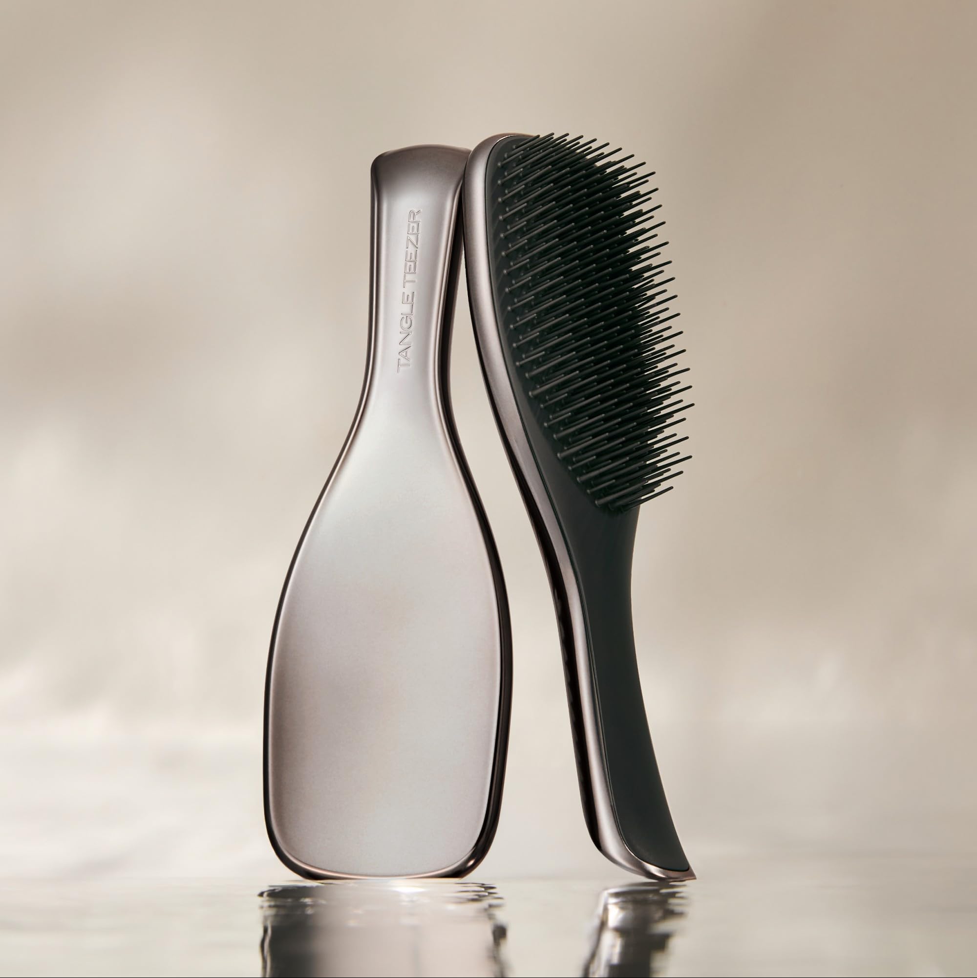 Tangle Teezer Chrome two-tier teeth gently detangle wet and dry hair.