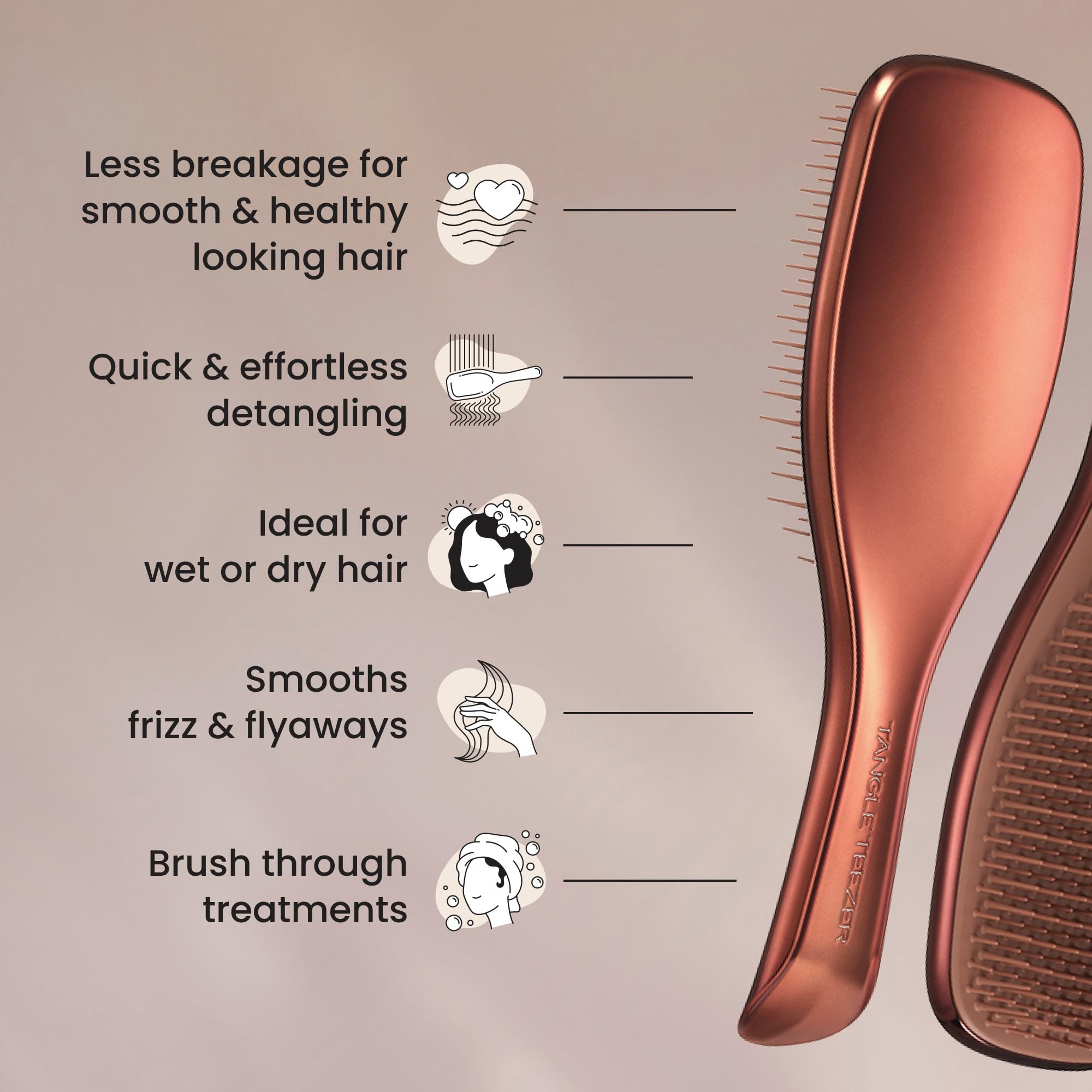 Tangle Teezer Chrome Ultimate Detangler held in hand during shower