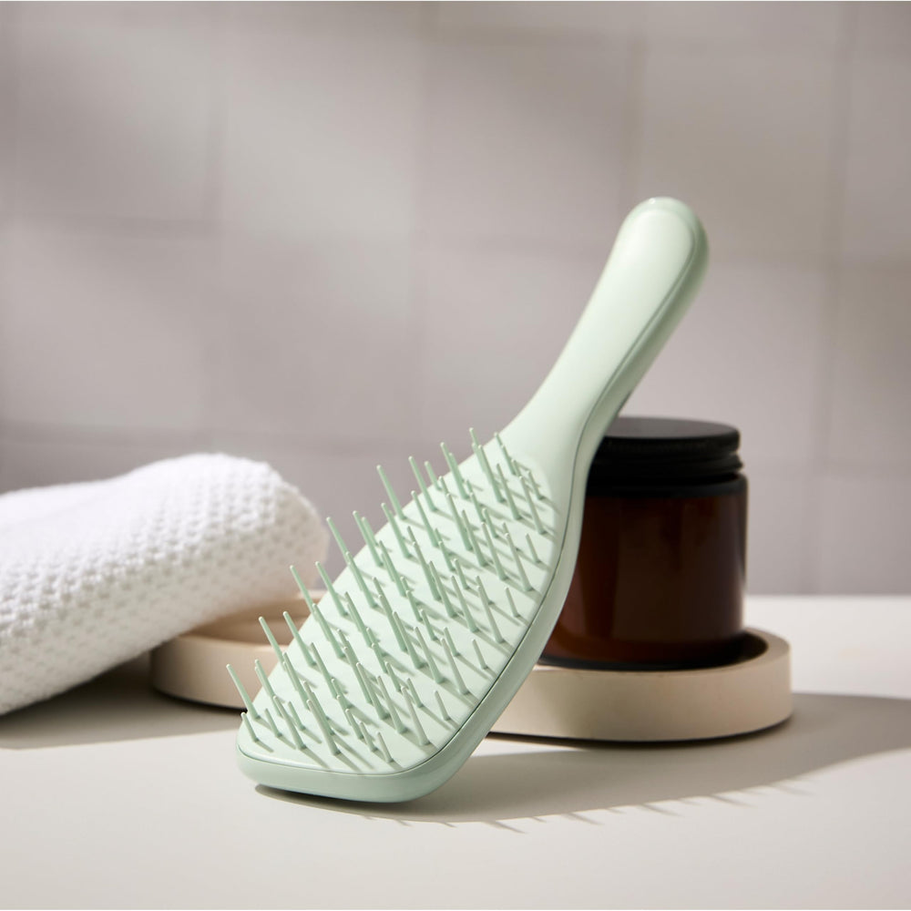 Tangle Teezer Extra Gentle Detangler used on dry knots starting at the ends for easier detangling.