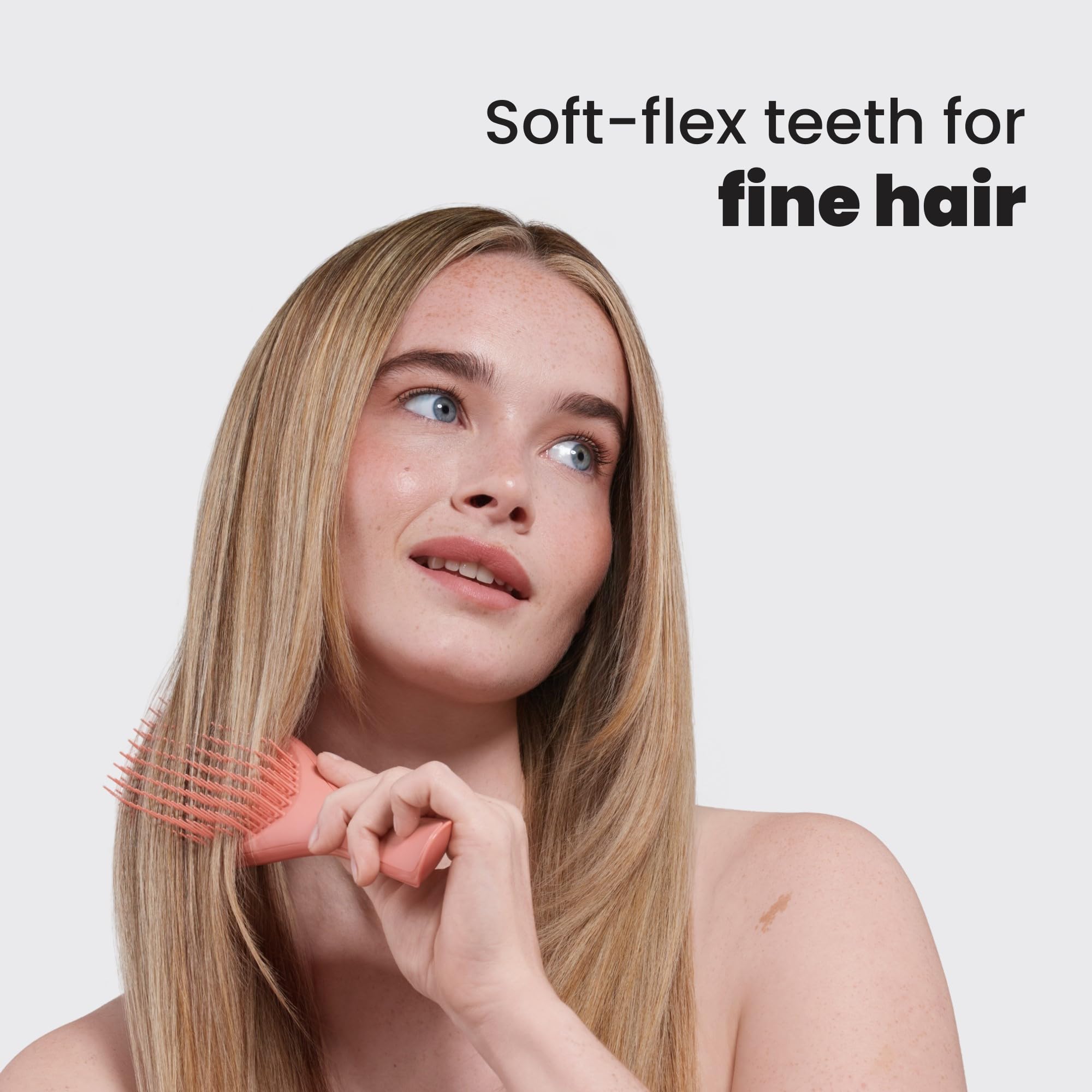 Tangle Teezer detangler in hand for both wet and dry hair detangling.