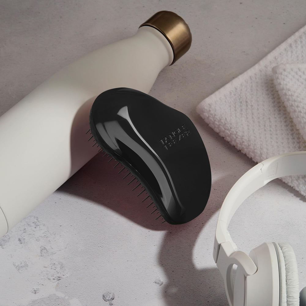 Tangle Teezer Original Detangler Panther Black in use on dry hair for knot release