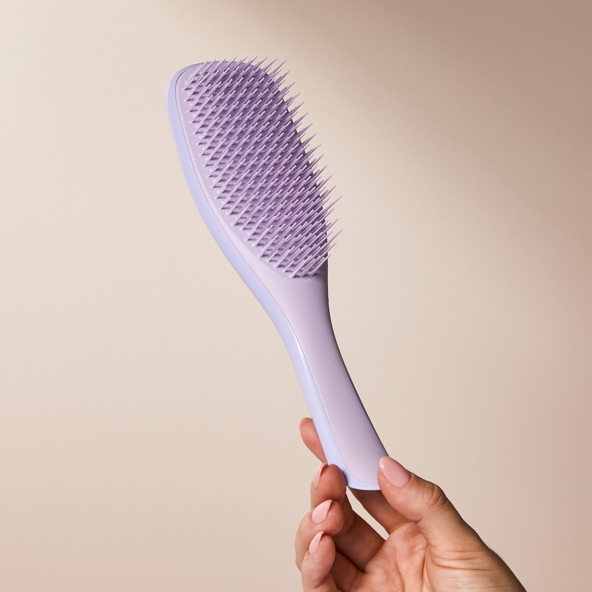 Tangle Teezer Sustainable Packaging Transition close-up notes eco-friendly design.