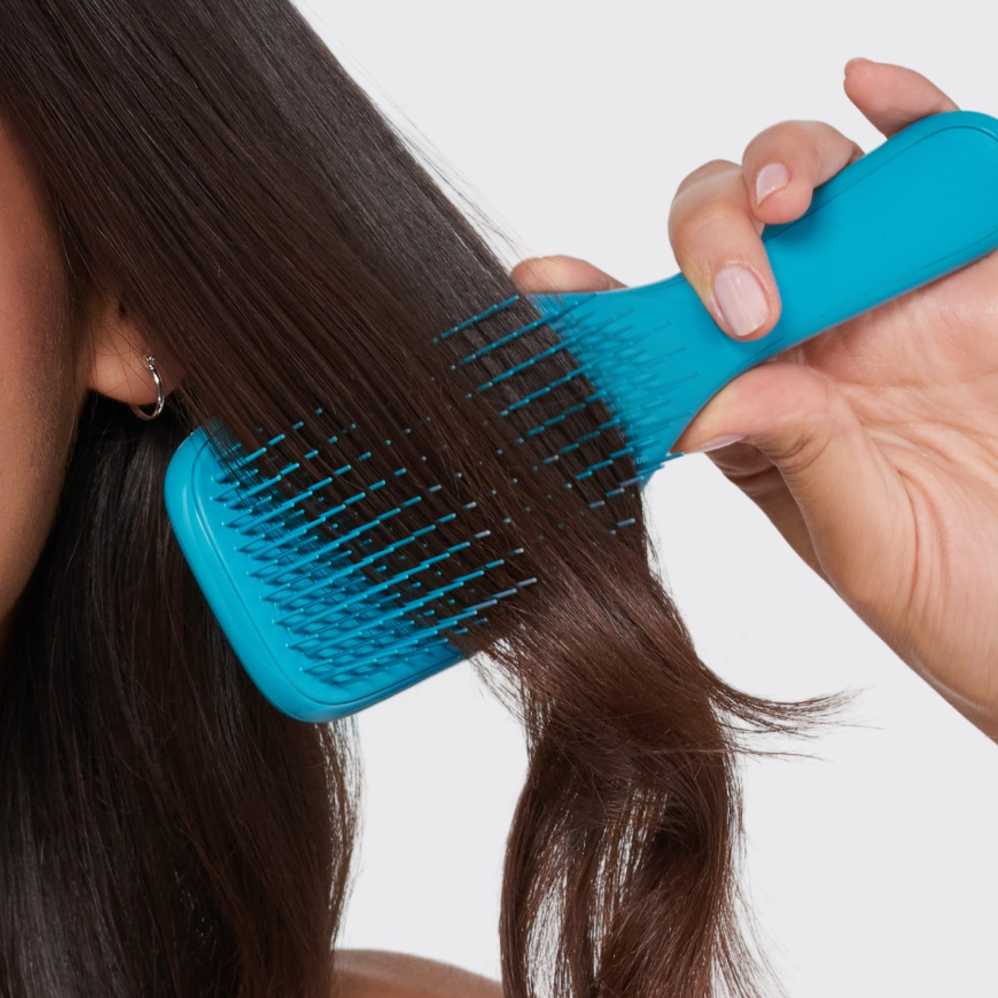 Tangle Teezer Ultimate Detangler in bathroom setting for routine use.