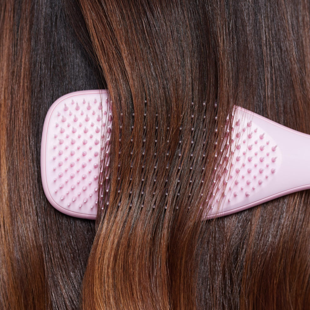 Tangle Teezer Ultimate Detangler lifestyle shot in a bathroom setting