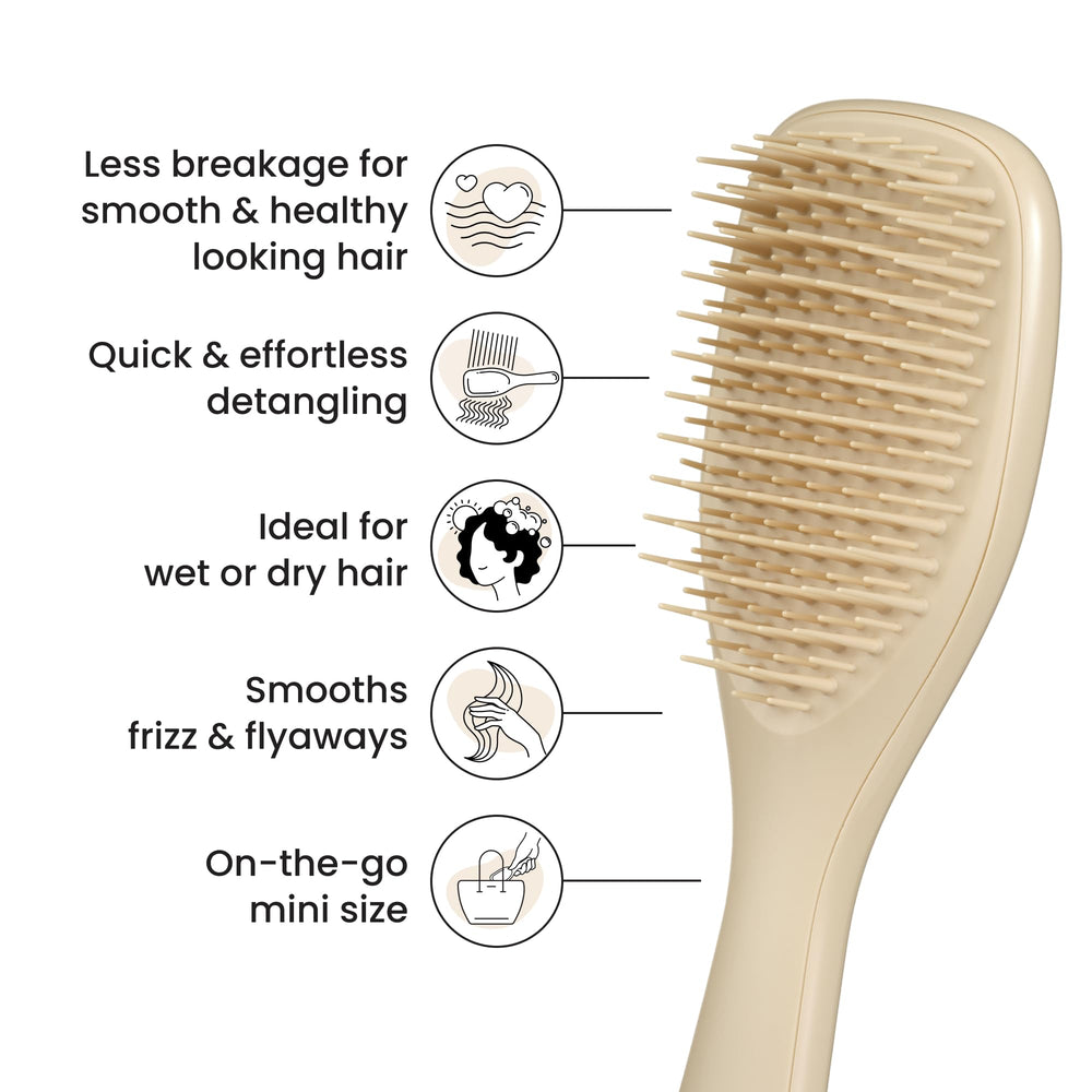 Tangle Teezer Ultimate Detangler being used on dry hair to smooth strands