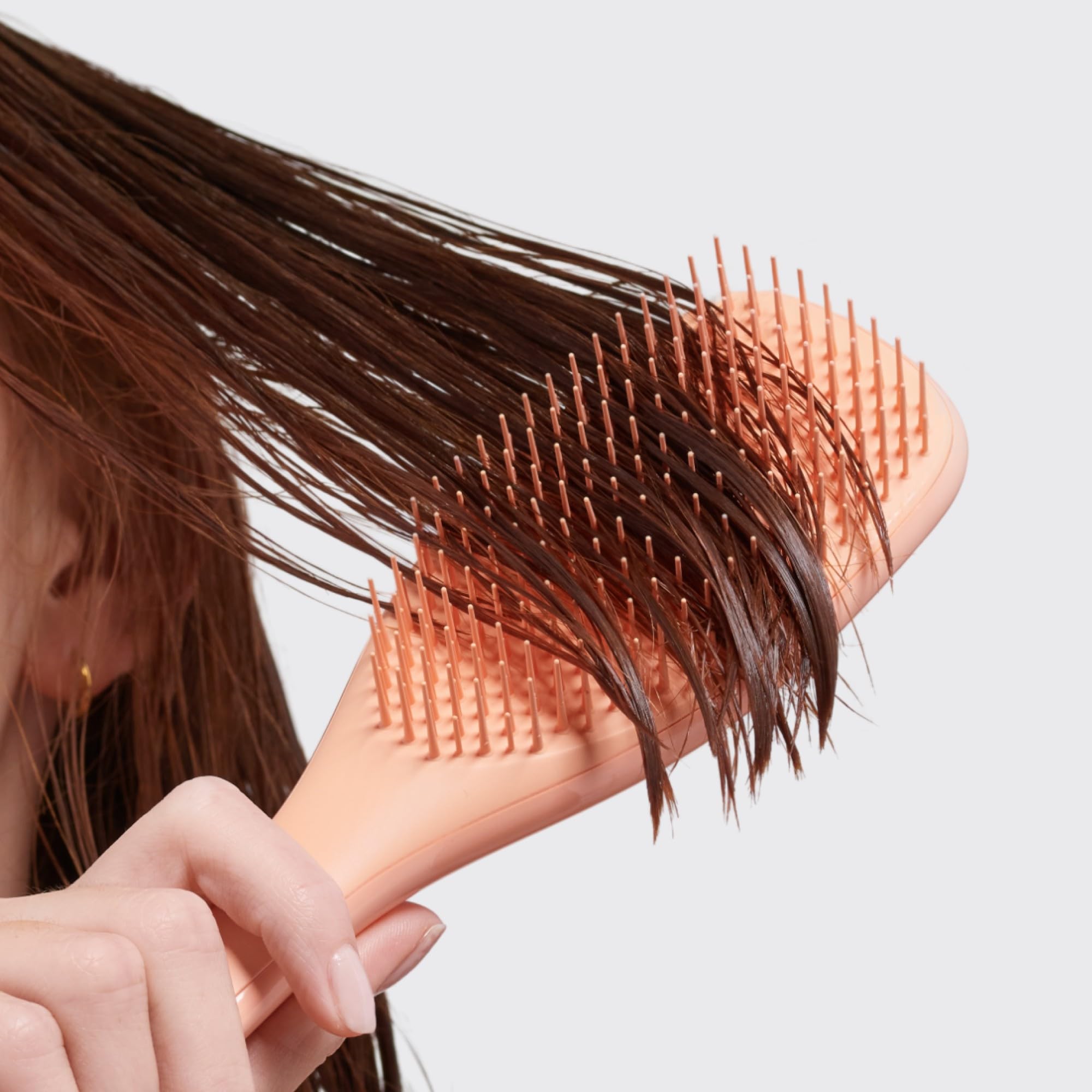 Detangler in action delivering smoother, tangle-free hair