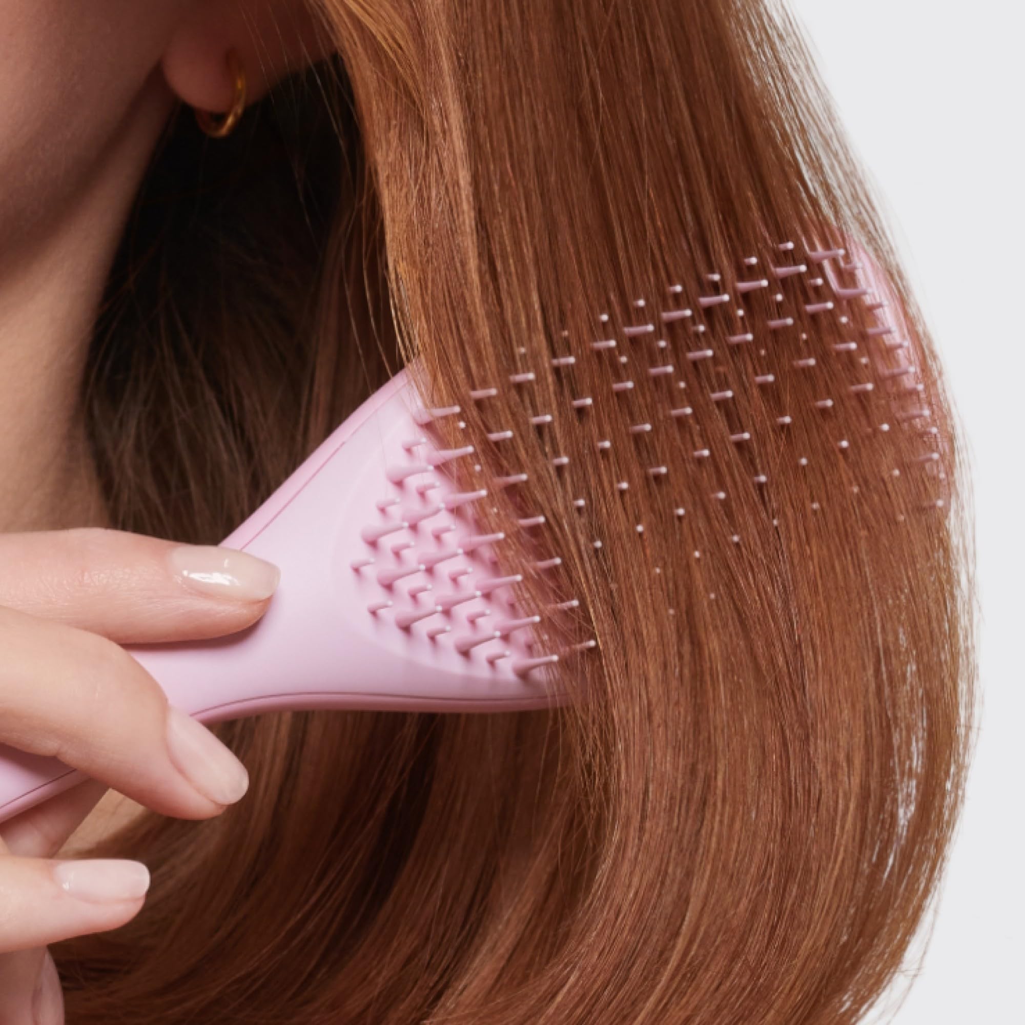 Tangle Teezer Ultimate Detangler ideal for quick styling between activities and workouts.