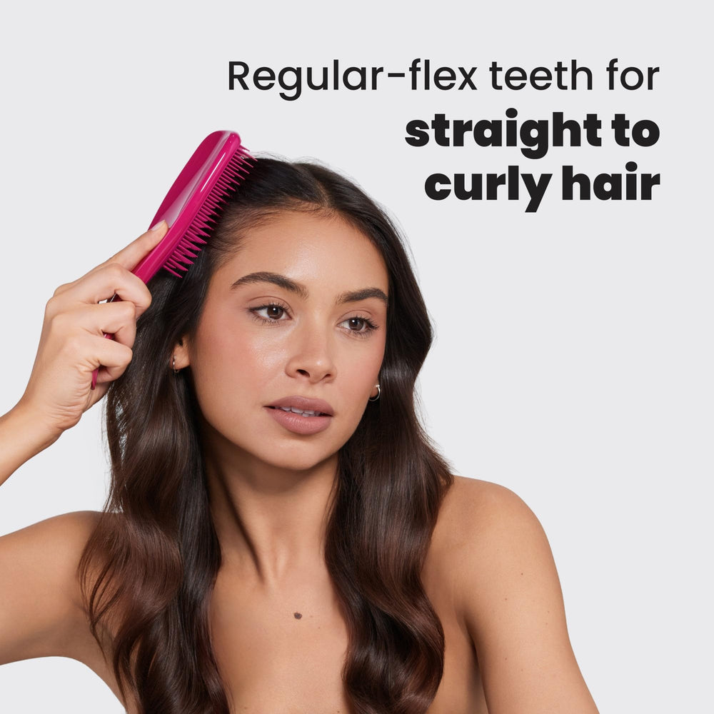 Tangle Teezer used to distribute conditioner through wet hair.