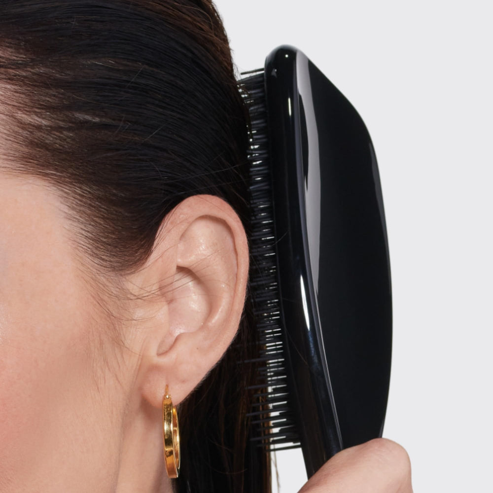 Tangle Teezer sustainable packaging transition while maintaining brush quality.