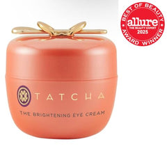 Tube close-up of TATCHA Brightening Eye Cream with premium finish.