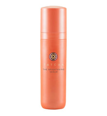 TATCHA Brightening Serum bottle close-up showing glow from vitamin C