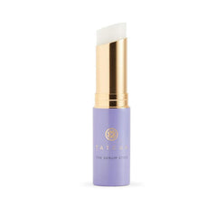 TATCHA The Serum Stick applied to the face for quick hydration and smoothing.