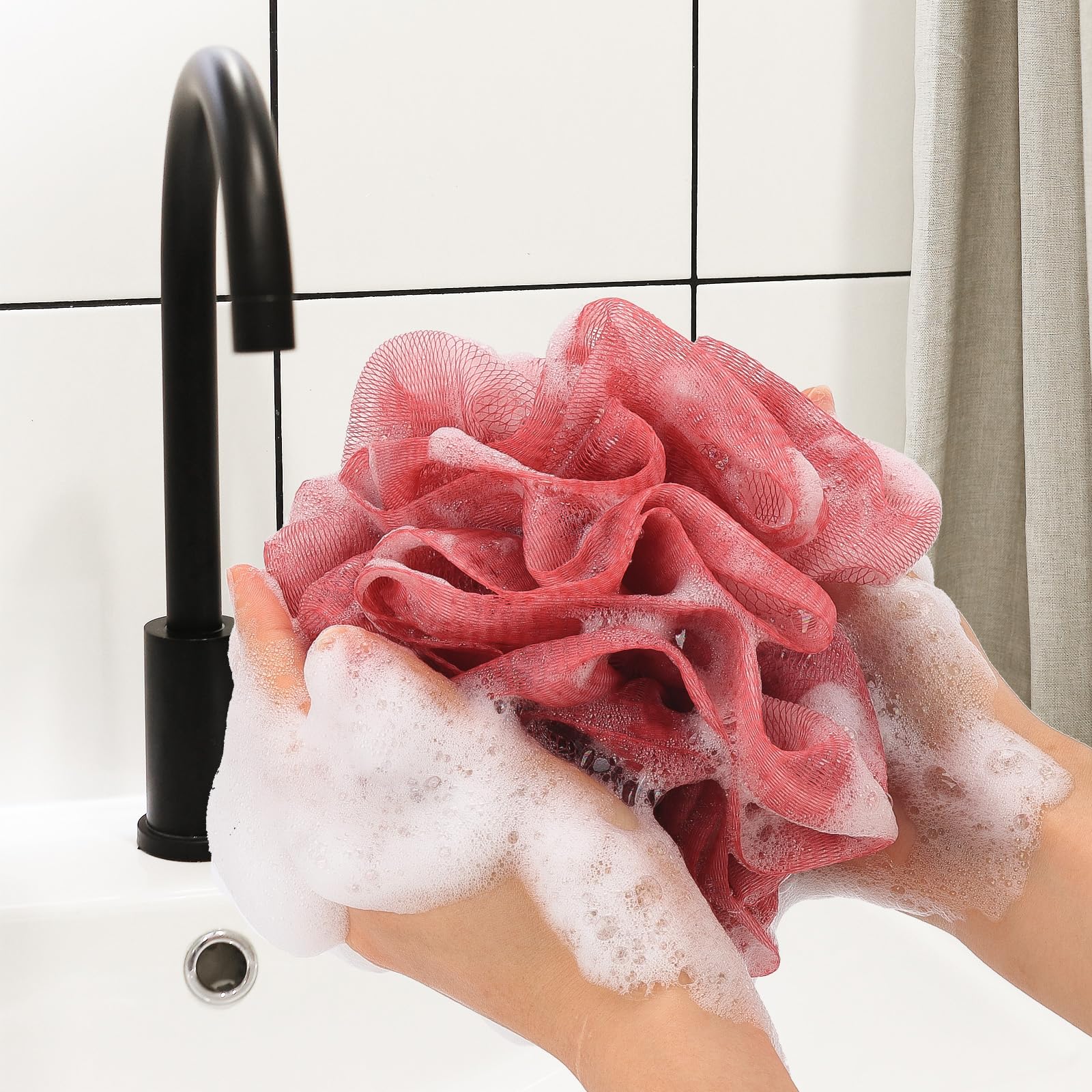Esponja de baño Tbestmax azul con malla, ideal para generar espuma abundante.