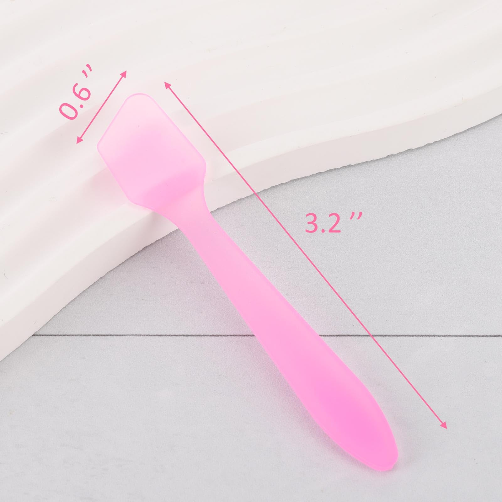 Tbestmax pink spatula in hand applying facial cream hygienically