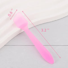 Tbestmax pink spatula in hand applying facial cream hygienically