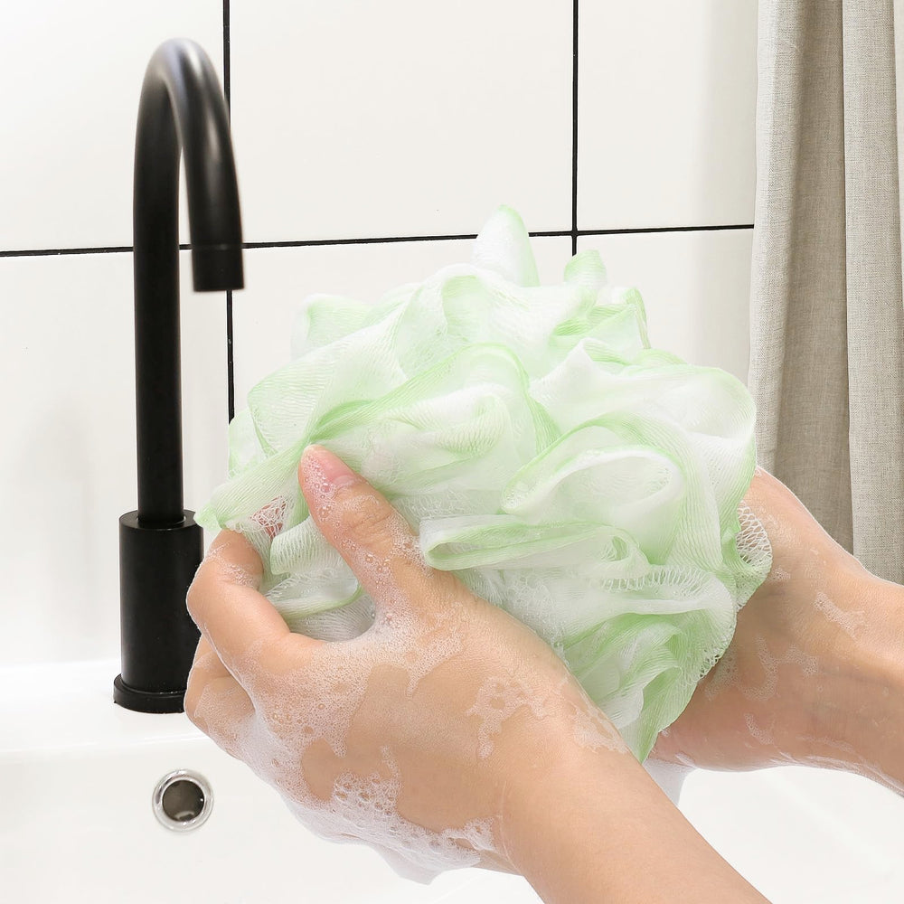 Tbestmax shower loofah with hanging loop for easy drying and storage after showers.