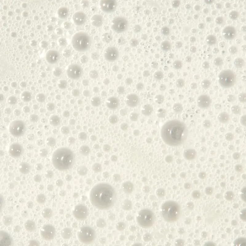 Tea Tree shampoo lather closeup showing smooth, manageable hair