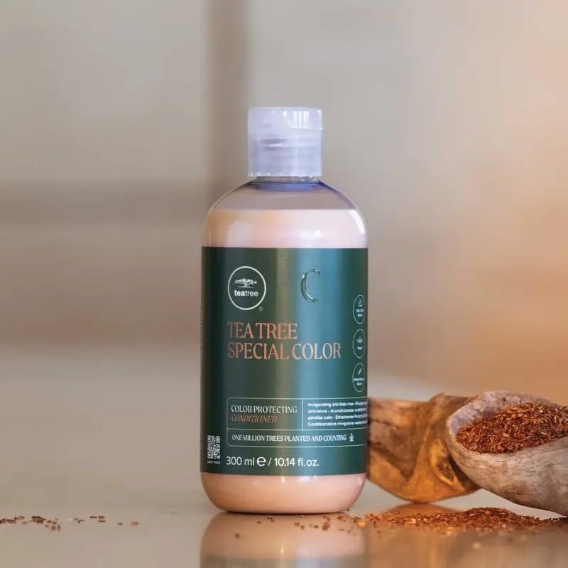 Applying Tea Tree Special Color Conditioner to detangle hair