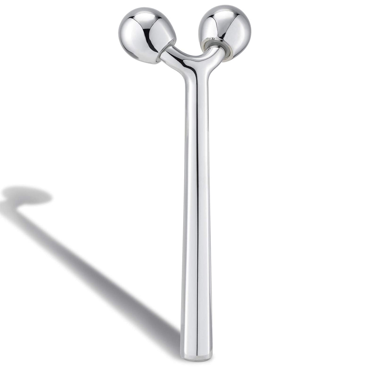 Tekson facial roller with 3D metal design delivering a smooth glide.