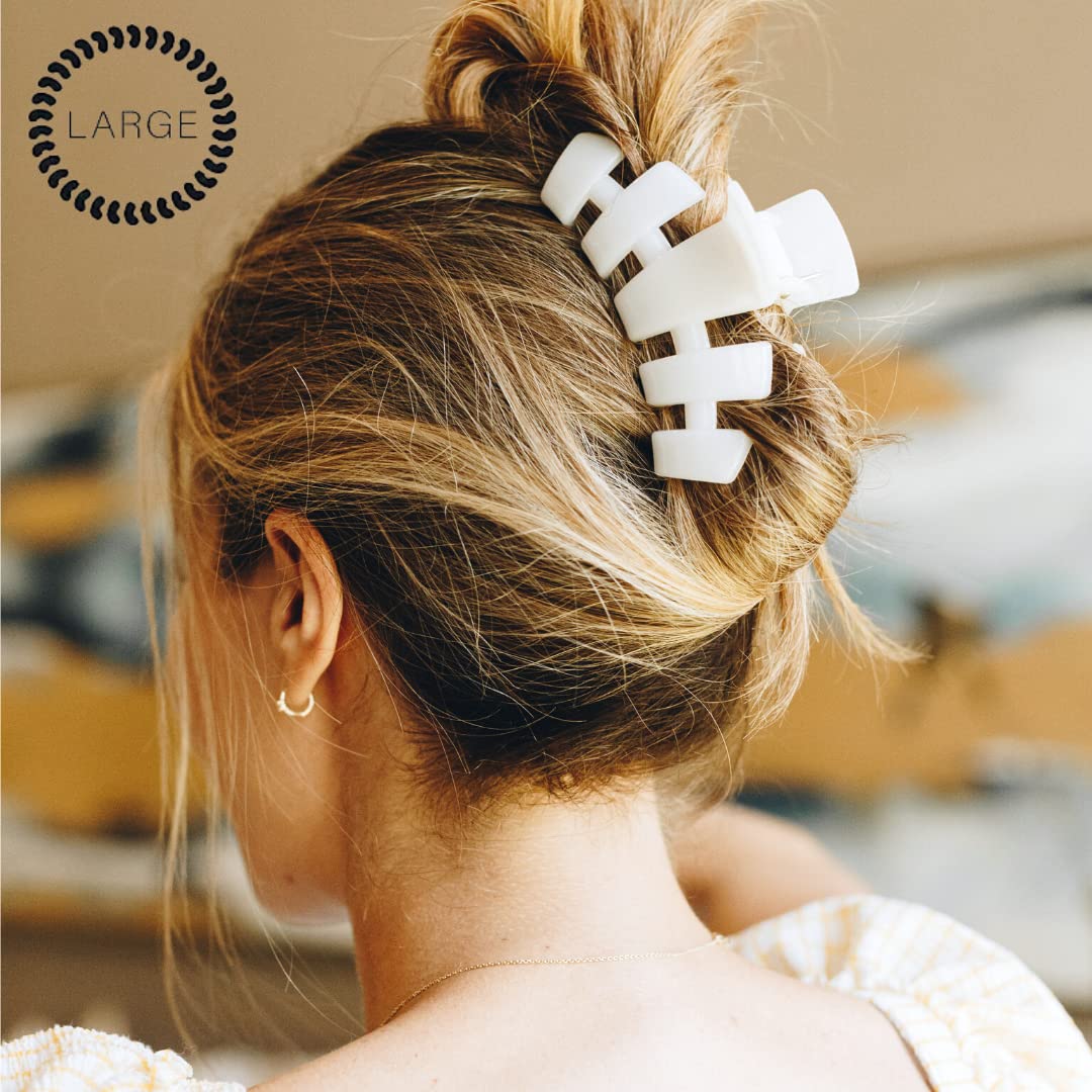 Teleties large hair clip on dense hair for secure hold.