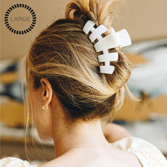 Teleties large hair clip on dense hair for secure hold.