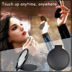 Tenalleys mirror in hand, compact design for quick makeup checks.