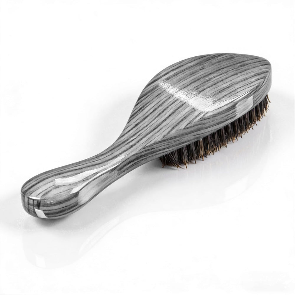Terrilee beech-shell brush with natural boar bristles close-up for durable wave shaping.