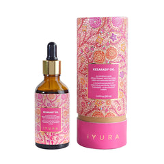 The Ayurveda Experience Kesaradi face oil bottle glows with saffron hydration.