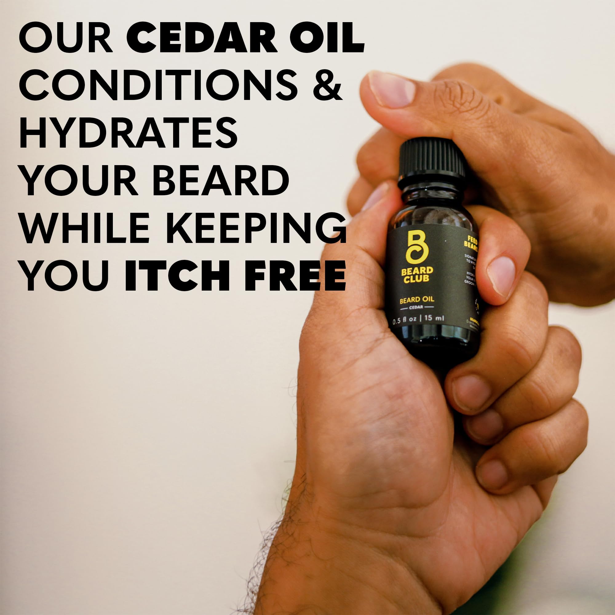 The Beard Club boar bristle brush distributing oil evenly through the beard