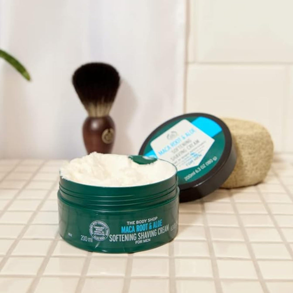 Man applying The Body Shop shaving cream for a smooth, careful shave.